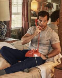 Actor Henry Cavill with a telephone receiver.
