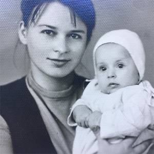 Alena Sviridova at the age of six months with her mother