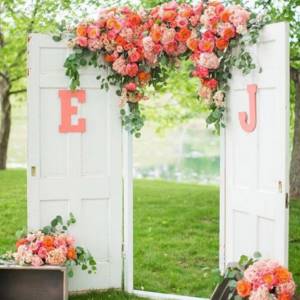 arch with coral flowers for a wedding