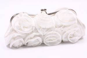 White wedding handbag of the bride with roses