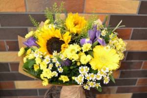 Bouquet of daisies, sunflowers and irises