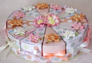 Paper cake with wishes to guests and gifts for the anniversary