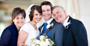 What should the parents of the bride and groom do at a wedding?