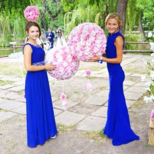 Photo of two bridesmaids in blue dresses
