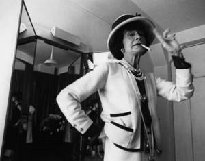 Photo of Coco Chanel with a cigarette