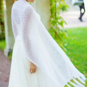 Photo of a cape on a wedding dress for a wedding in the fall - stole