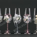 Champagne glasses with flowers and ribbons