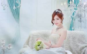 Chinese bride in white dress at wedding