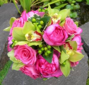 Combination of roses and green orchids