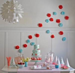 red and blue paper pompoms dessert table
