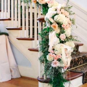 attach flowers to the staircase railings