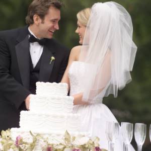 Newlyweds and wedding cake