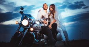 husband and wife on a motorcycle