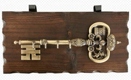 Wall-mounted key holder in the form of a cast iron key