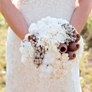 bride holding wedding bouquet with cotton
