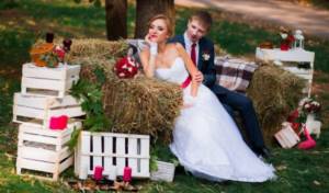 bride and groom on a straw sofa
