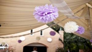 Soft lilac and white paper balls hanging from the ceiling