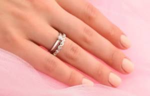 wearing an engagement ring