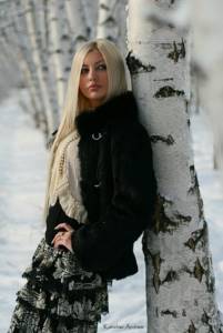 poses for a photo shoot in winter