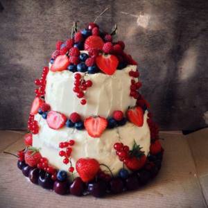 seasonal berries on cream wedding cake