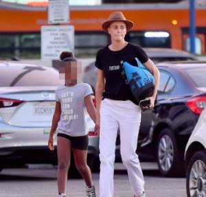 Charlize Theron and her son Jackson are leaving the supermarket.
