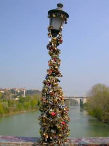 wedding padlocks; lantern of the bridge over the Milva 
