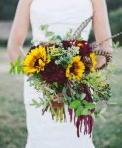 wedding bouquet of the bride in burgundy color