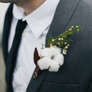 decorating a wedding jacket with a cotton flower