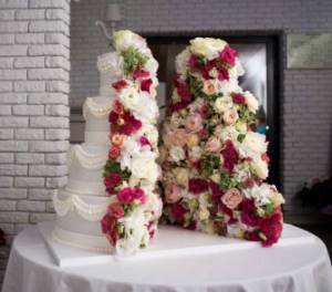 Decorating a cake with fresh flowers