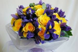 Bright bouquet of roses and iris
