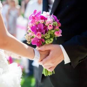 bride and groom with a bouquet