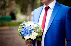 groom in a blue jacket